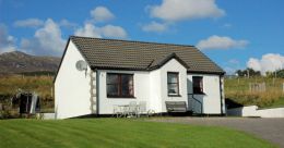 Tarlogie is a small detached 2-bedroom bungalow standing in an elevated position with superb sea and mountain views.