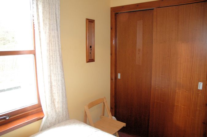 The twin bedroom in Tarlogie has a good sized built-in wardrobe.
